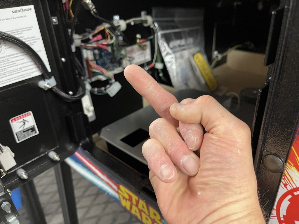 Giving the middle finger to the cabinet node board on a Stern pinball Star Wars Comic Pro pinball.